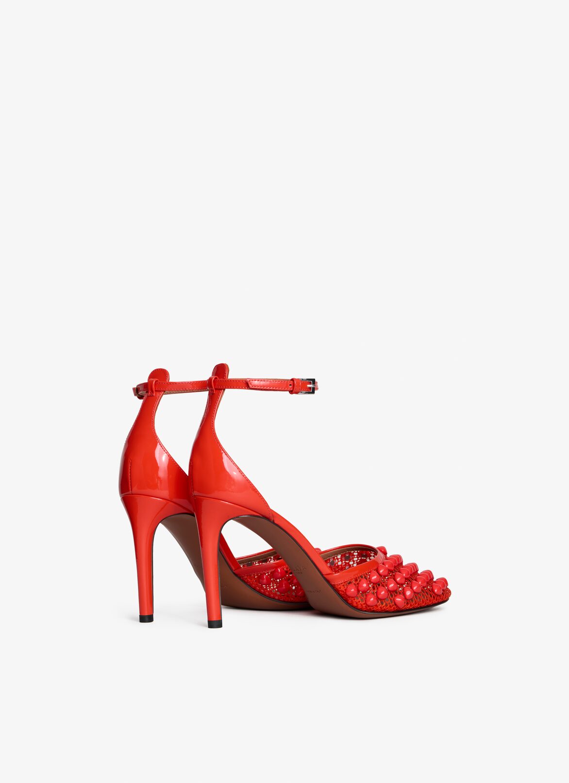 HIGH FISHNET PUMPS WITH STUDS ALAÏA ORANGE HIGH FISHNET PUMPS WITH STUDS